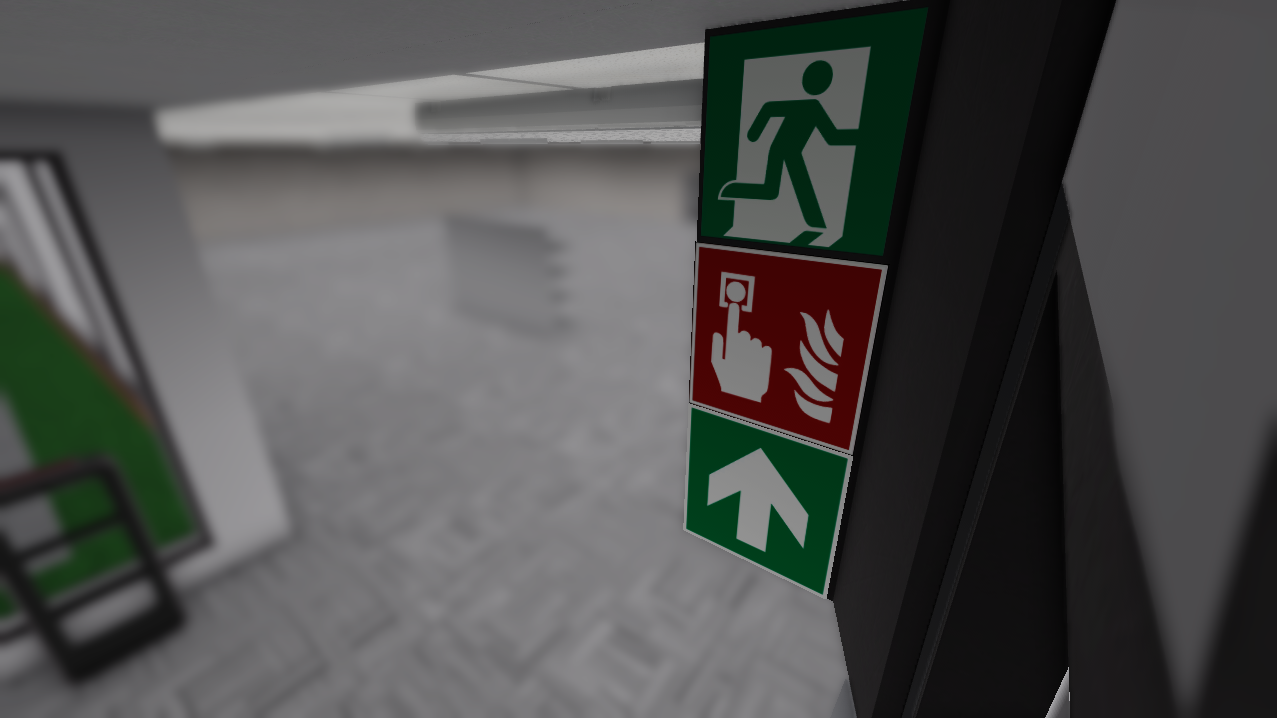 Fire callpoint and emergency exit signs.